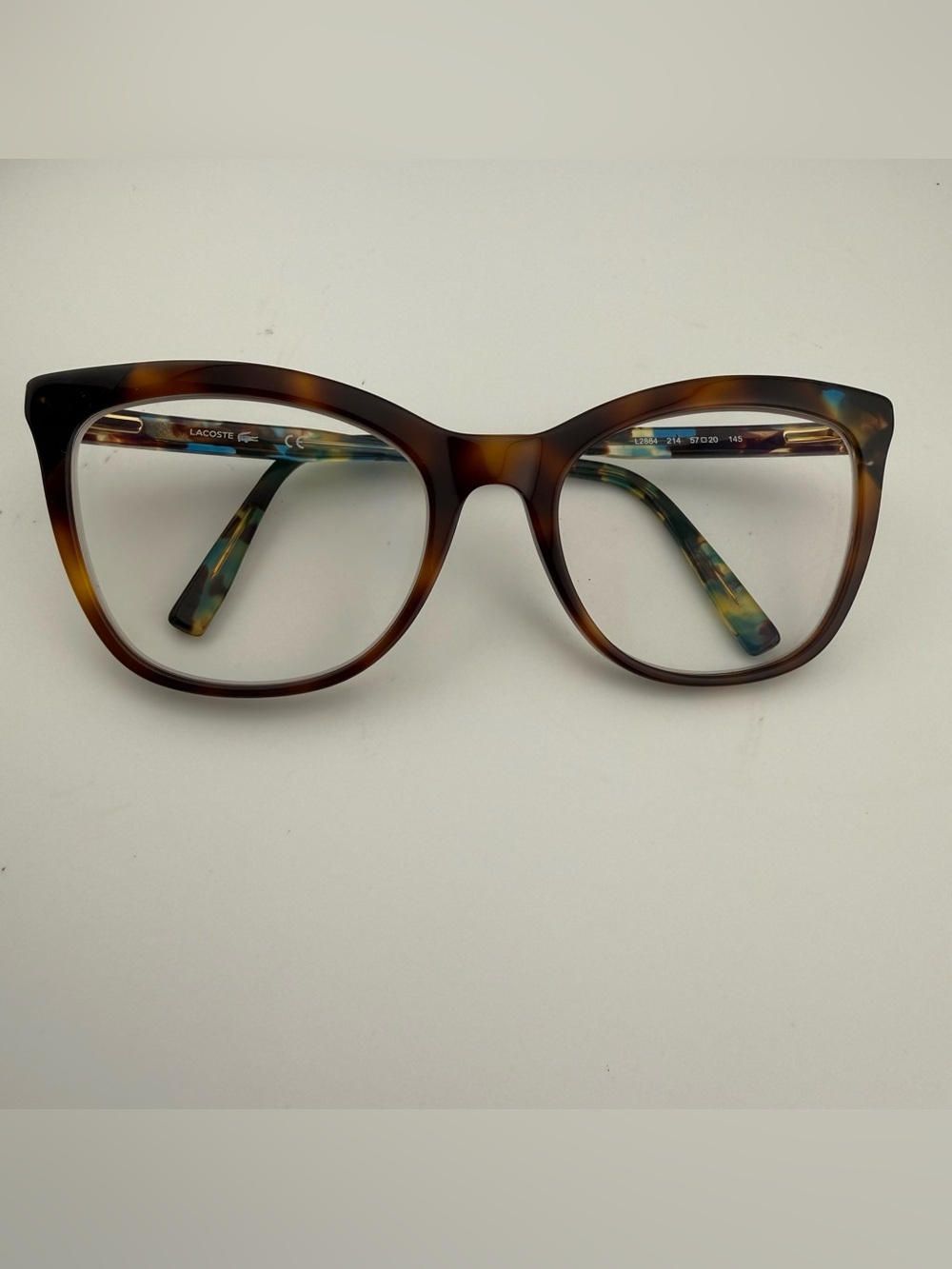 Lacoste Women's Tortoise Round Frame Glasses with Green-Blue Marble Temples